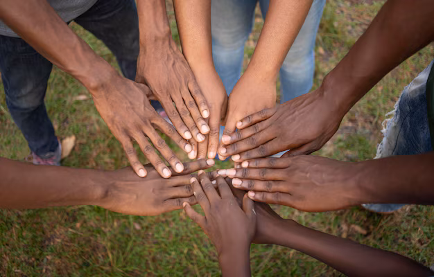 community of people holding hands